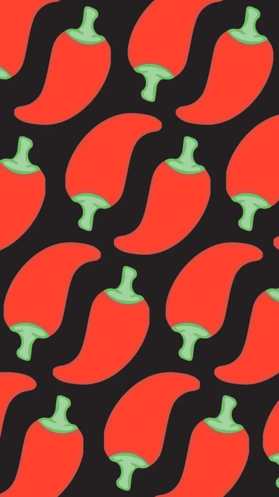 A colourful pattern of red chilli peppers against a black background.